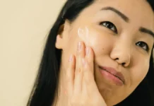 Anti-Aging Skincare Routine: Building One That Actually Delivers Woman applying anti-aging skincare cream to her face