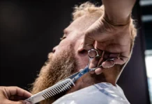 Beard Dye: Shade Matching and Patch Testing Barber grooming a man's beard