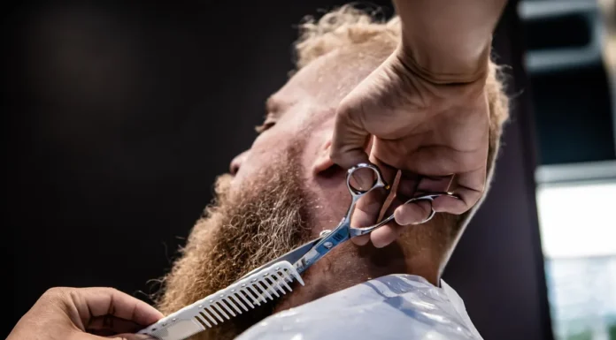 Beard Dye: Shade Matching and Patch Testing Barber grooming a man's beard