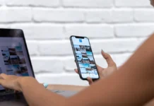 Blue Light Protection Skincare: What the Evidence Shows Woman using a laptop and smartphone, blue light exposure