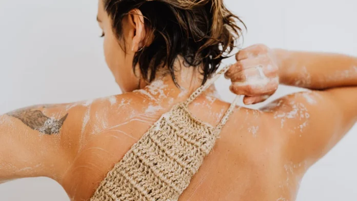 Body Scrubs Exfoliating the skin with a loofah in the shower