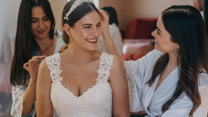 Bridal Beauty Prep Bride getting ready with bridesmaids before the wedding