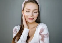 Cica Creams: Calming a Compromised Skin Barrier Woman applying a soothing cica cream to calm skin