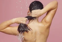 Clarifying Shampoo vs Chelating: Which One Your Hair Actually Needs Washing hair under the shower with clarifying shampoo