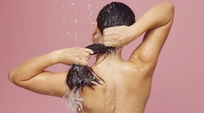Clarifying Shampoo vs Chelating: Which One Your Hair Actually Needs Washing hair under the shower with clarifying shampoo