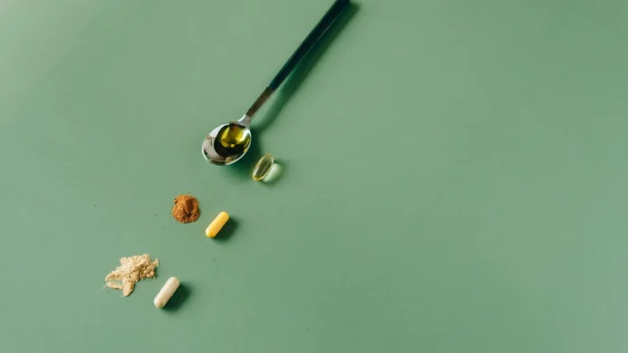 Collagen Supplements Collagen powder supplement with a spoon