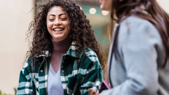 Woman with long curly hair, curly hair products guide