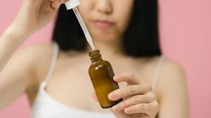 Dark Spot Treatments Applying a dark spot treatment serum to the face