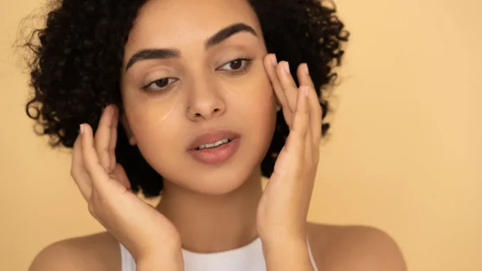 Eye Creams and Serums Woman applying eye cream to the delicate under-eye area