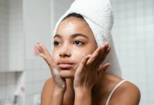 Face Cleansing Routine: Double Cleansing and Choosing a Cleanser Woman cleansing her face as part of a skincare routine