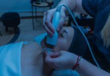 Facial Toning and Microcurrent Devices: A Realistic Review Woman using a facial toning skincare device