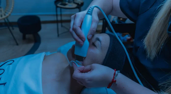 Facial Toning and Microcurrent Devices: A Realistic Review Woman using a facial toning skincare device