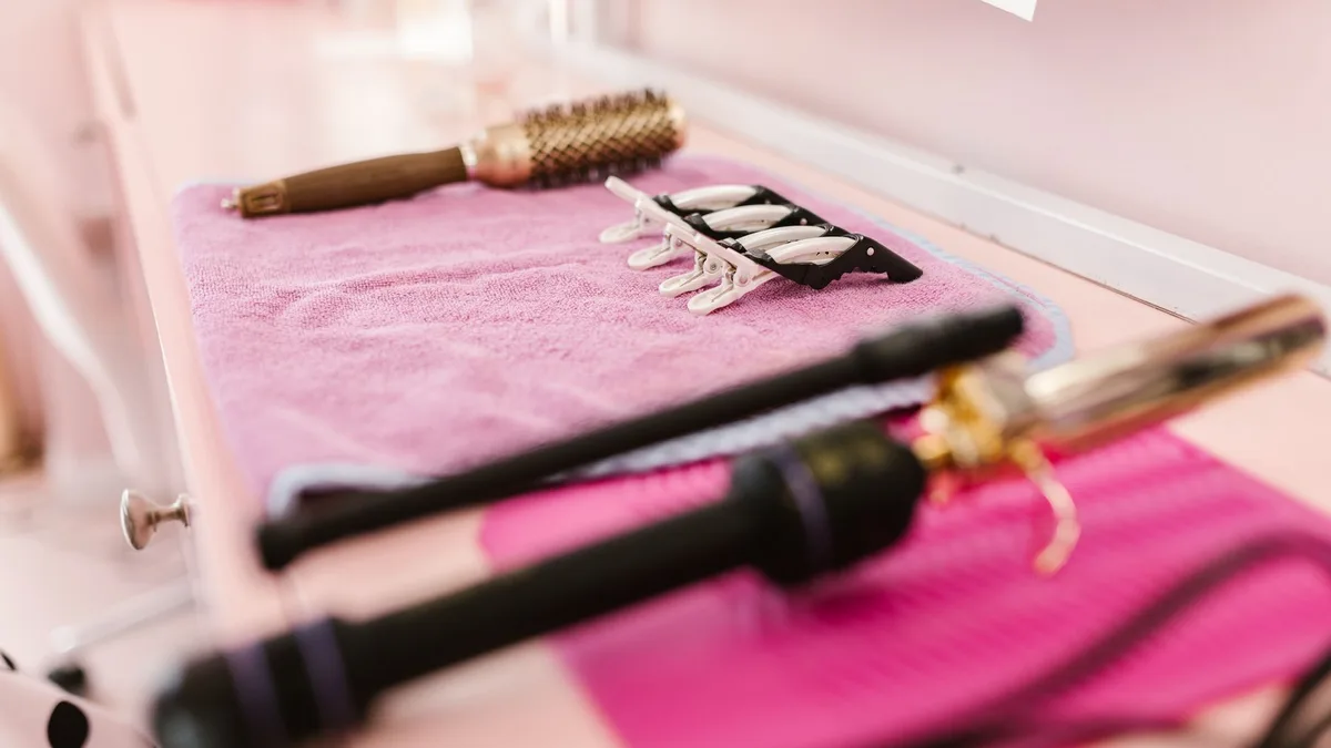 A selection of hair styling tools laid out in a salon