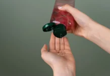 Frizz Control Gel: Hold Levels, Cast Breaking and Flaking Fixes Dispensing frizz control gel from a bottle into a palm