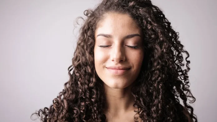 Woman with full healthy hair, hair growth treatment guide