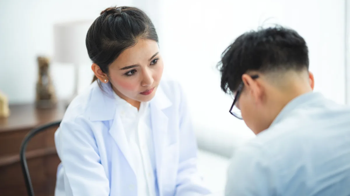 Doctor listening to a patient during a consultation