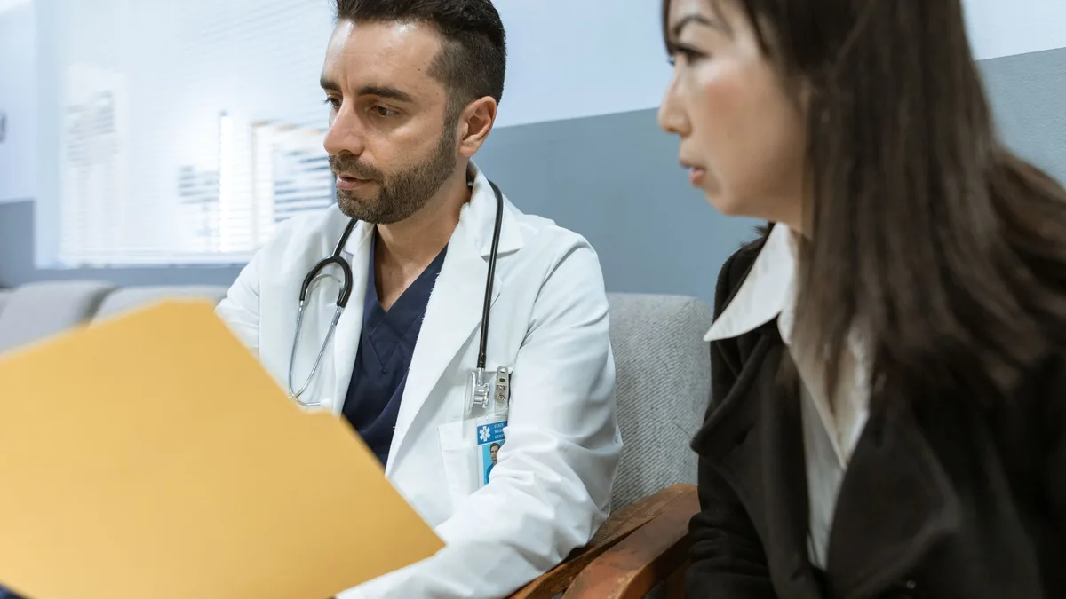 Doctor discussing health records with a patient