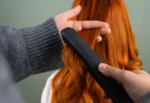 Hair Smoothing Treatments: Keratin, Bond-Builders and Salon Options Smoothing long hair with a flat iron, hair smoothing treatment