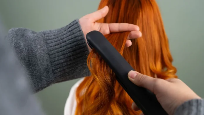 Hair Smoothing Treatments Smoothing long hair with a flat iron, hair smoothing treatment