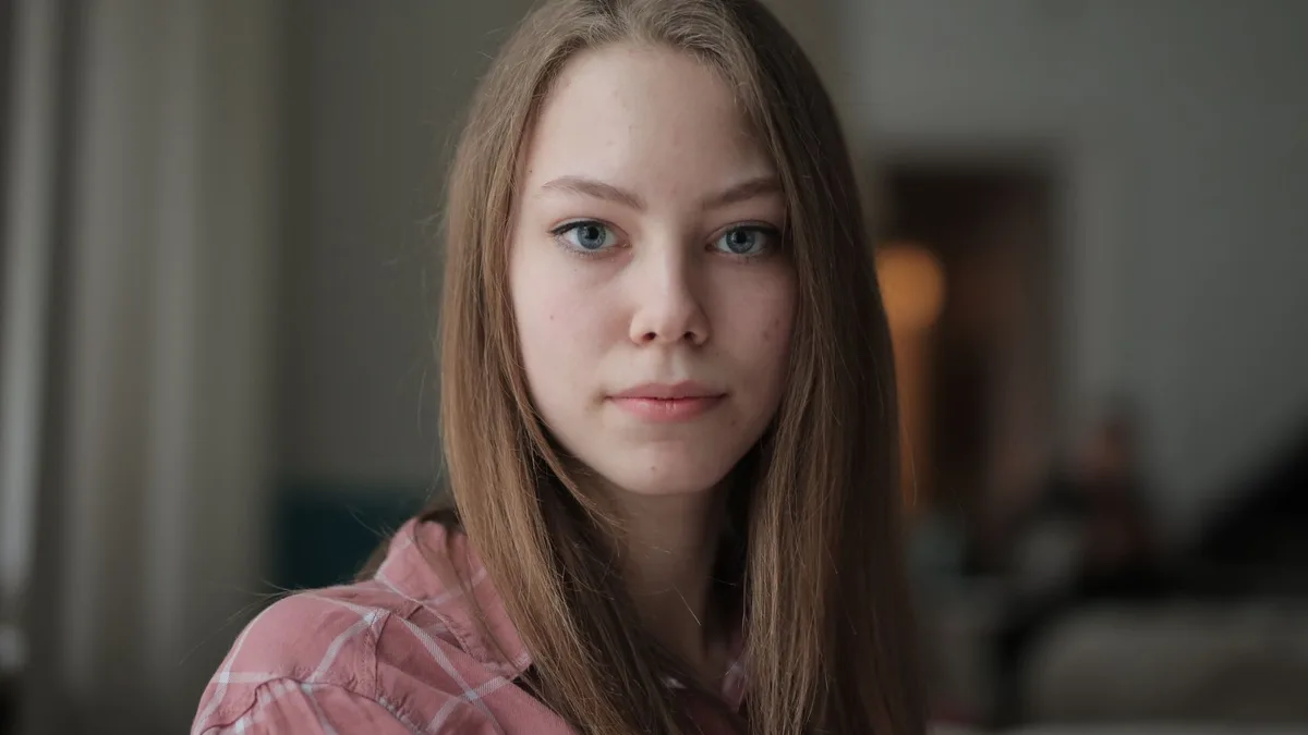 Portrait of a young woman with long fine hair
