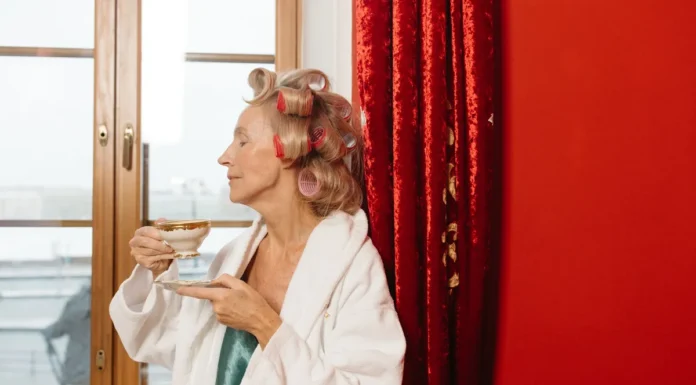 Hot Rollers: Salon Volume With the Gentlest Heat in the Drawer Woman with hair rollers in for volume and bounce