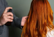 Humidity-Resistant Hair Spray: What to Look For on the Label Spraying humidity-resistant hair spray onto long hair