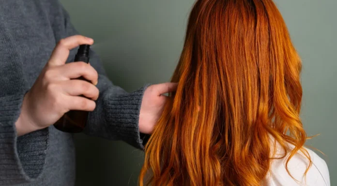 Humidity-Resistant Hair Spray: What to Look For on the Label Spraying humidity-resistant hair spray onto long hair