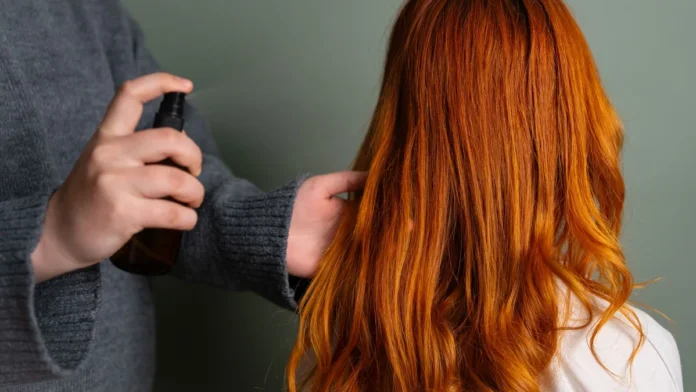 Humidity-Resistant Hair Spray Spraying humidity-resistant hair spray onto long hair