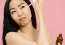 Korean Skincare Routine: The Layering Method Explained Woman applying skincare serum for glowing skin