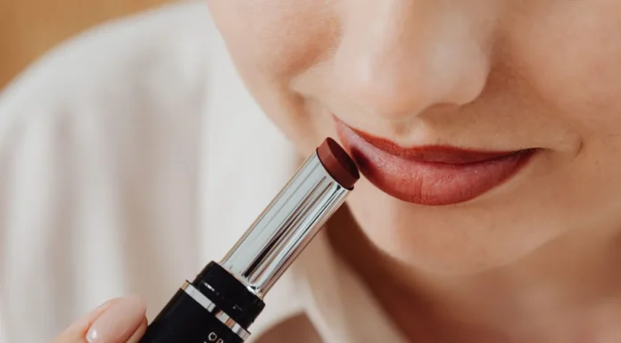 Lip Care and Lip Makeup: From Prep to Long-Wear Colour Woman applying lipstick, close-up