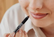 Lip Liner: Shaping, Overlining and Shade Pairing Woman applying lip liner, close-up