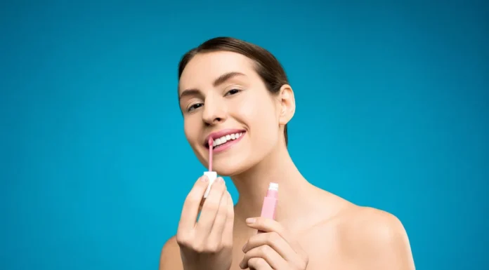 Lip Oils vs Lip Balms: Shine, Care and Staying Power Woman applying glossy lip oil