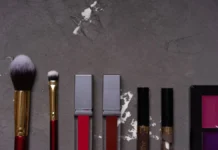 Makeup Brushes and Tools: Building and Maintaining a Kit Flat lay of makeup brushes and cosmetics