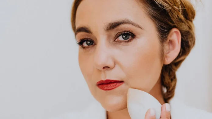 Makeup Sponges Woman applying makeup with a sponge