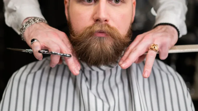 Men's Grooming Guide Bearded man receiving grooming at a barbershop