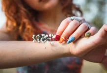 Nail Art at Home: Stamping Kits, Tools and Beginner Designs Colourful nail art design on the hand