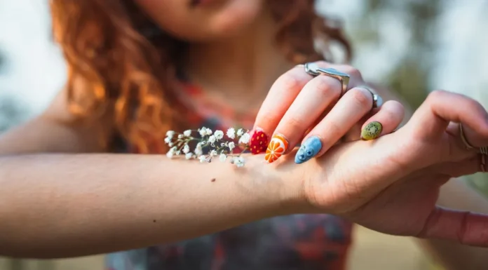 Nail Art at Home: Stamping Kits, Tools and Beginner Designs Colourful nail art design on the hand