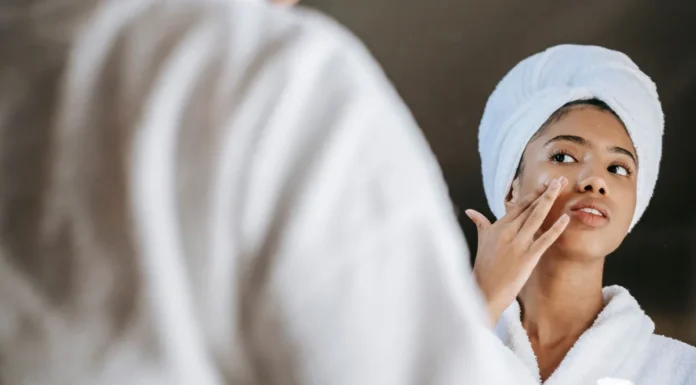 Overnight Sleeping Masks: Where They Fit in Your Routine Woman applying a nourishing night cream mask