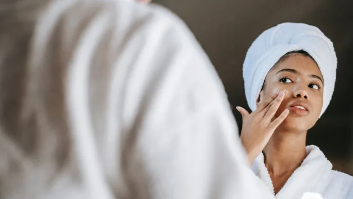 Overnight Sleeping Masks Woman applying a nourishing night cream mask