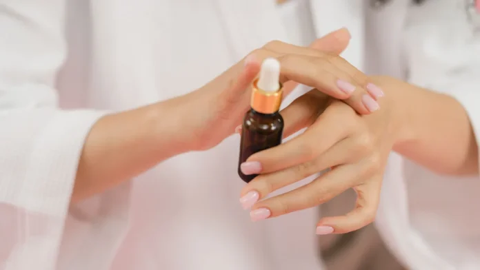Peptide Serums Applying a peptide skincare serum from a bottle