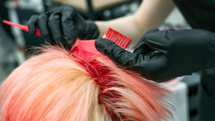 Root Touch-Up Sprays Applying colour to hair roots at the parting