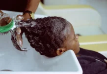 Scalp Care Routine: Treat It Like Skin, Because It Is Scalp being washed and cared for at a salon sink