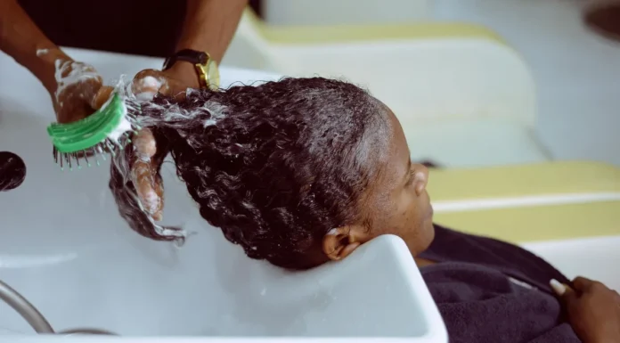 Scalp Care Routine: Treat It Like Skin, Because It Is Scalp being washed and cared for at a salon sink