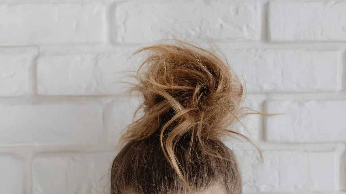 Close-up of hair gathered into a casual bun