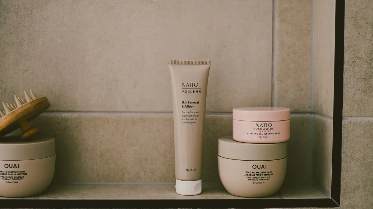 Minimalist bathroom shelf with hair care products