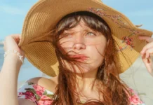 Sun Protection Clothing: Understanding UPF Ratings Woman in a straw sun hat for sun protection