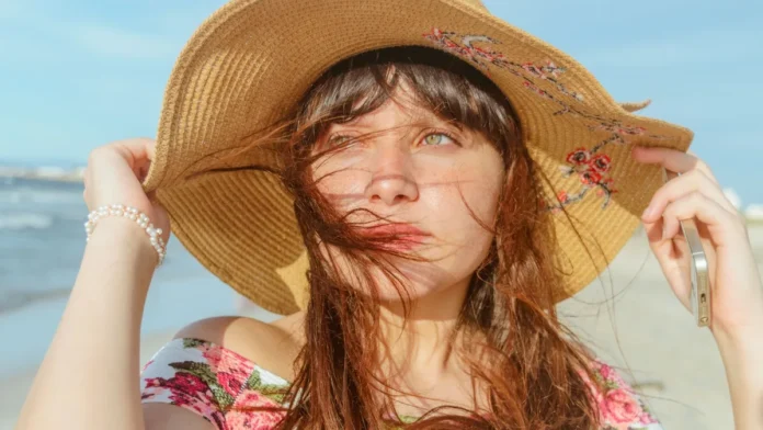 Woman in a straw sun hat for sun protection