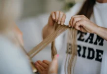 Tape-In Extensions: Cost, Maintenance and Removal Long hair wefts handled for tape-in extensions
