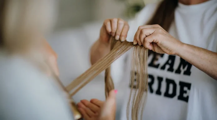 Tape-In Extensions: Cost, Maintenance and Removal Long hair wefts handled for tape-in extensions