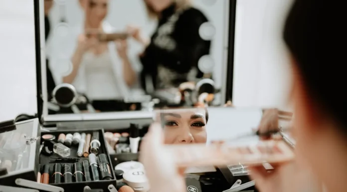 Wedding Makeup: Long-Wear, Flash-Proof and Trial Tips Bride having her wedding makeup applied by an artist